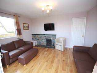 Lounge with open fire Smart TV holiday home South Devon